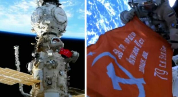 Nello spazio sventola la bandiera rossa della vittoria dell'Urss sulla Germania: l'ha esposta il cosmonauta del partito di Putin che farà una passeggiata con Samantha Cristoforetti